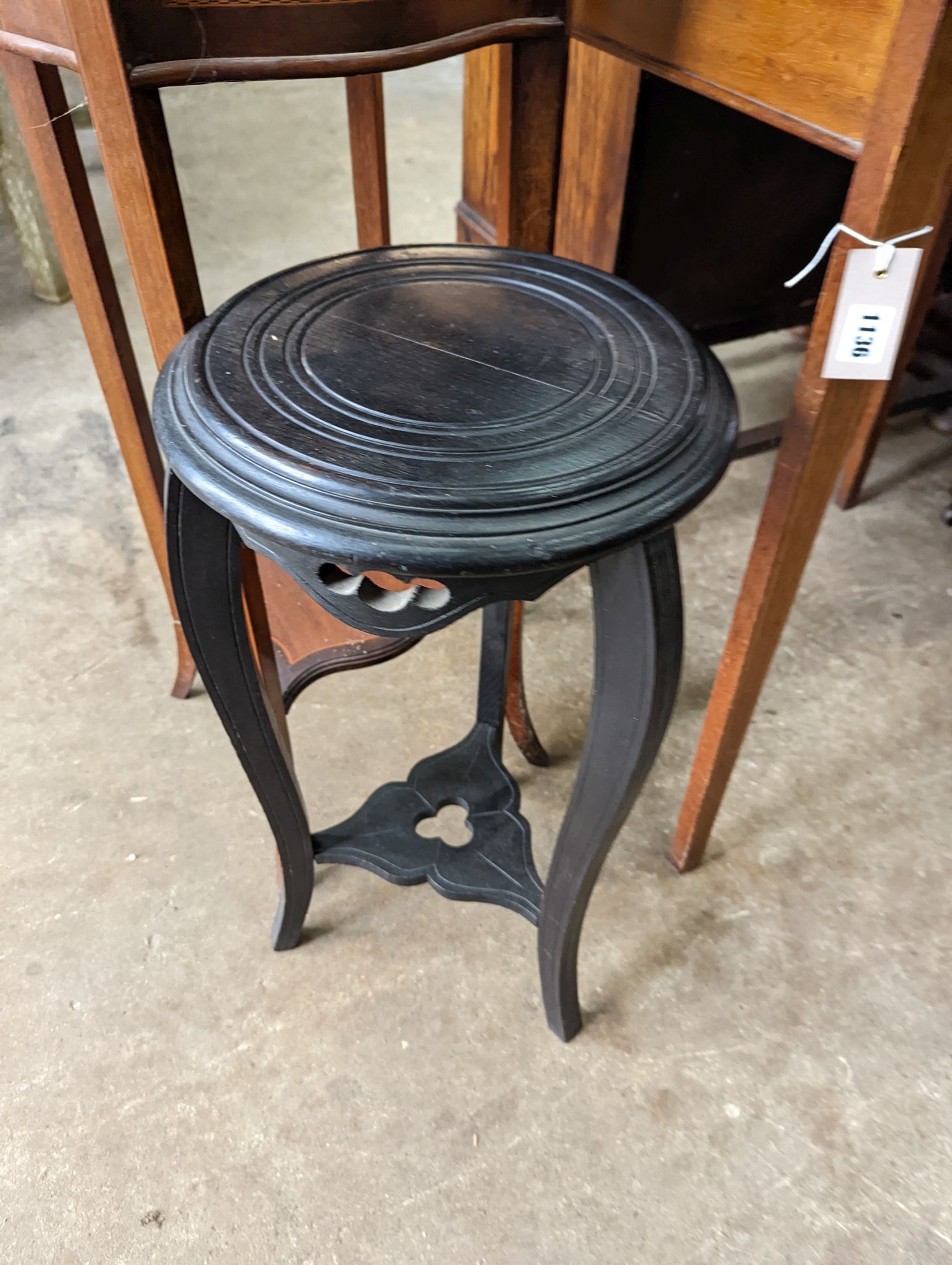 An Edwardian inlaid mahogany jardiniere with brass liner, height 99cm together with a small ebonised plant stand